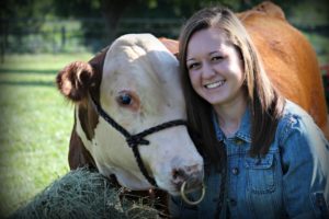 young woman with pet bull